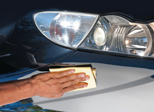 Cleaning solution applied to vehicle surface